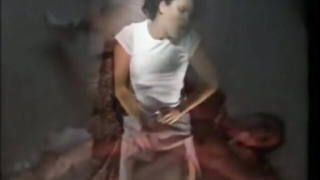 Amateur Asian woman dancing in tight white top and pink skirt