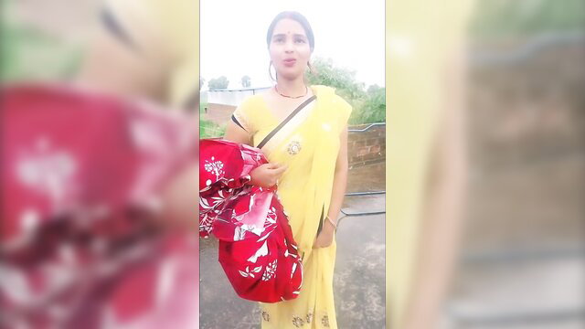 Desi bhabhi Mamta in yellow saree holding red bag, outdoor tease