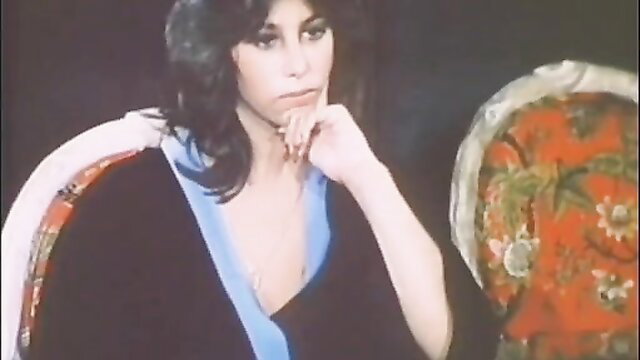 Cher-lookalike brunette posing seductively in retro 1981 porn thumbnail