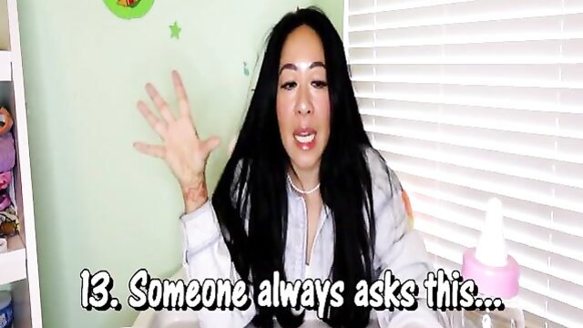 Diaperperv answers ABDL questions in casual sweater, expressive pose