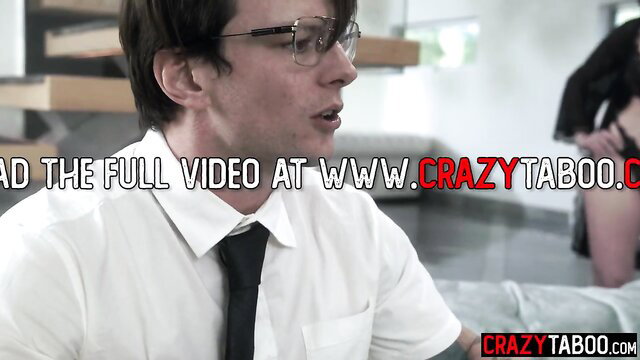 Dee Williams teases young man in shirt and tie on couch