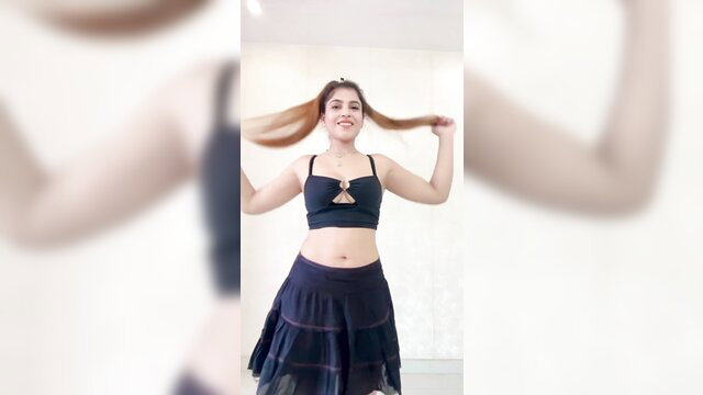 Desi Indian stunner in sexy black crop top and skirt tossing long hair