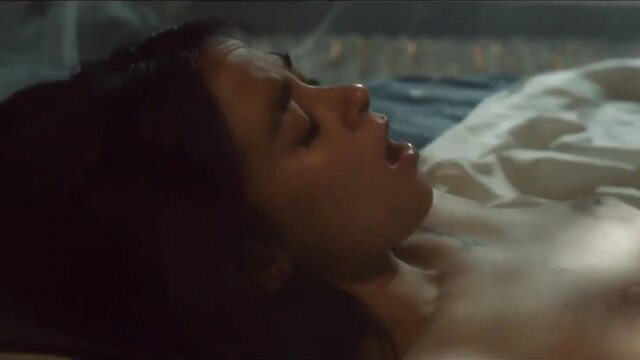 Asian beauty with parted lips in bed, nude JAV scene