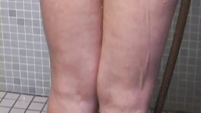 Slender Japanese MILF nude in shower, wet legs and thighs closeup