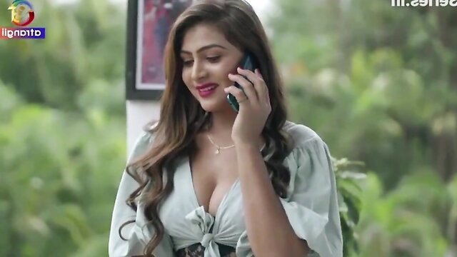 Horny Indian babe in deep cleavage top on phone call