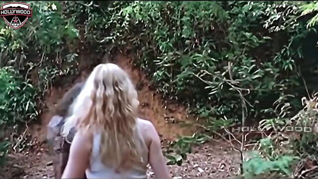 Blonde babe in tank top stalked by hairy man in jungle trail