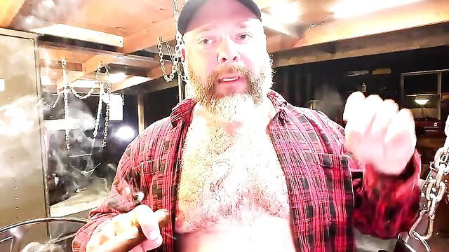 Daddy Kurt smokes cigar and strokes hairy chest in garage sling