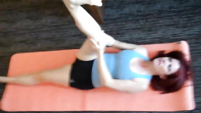 Small titted redhead Latina stretching yoga pose in shorts and tank top