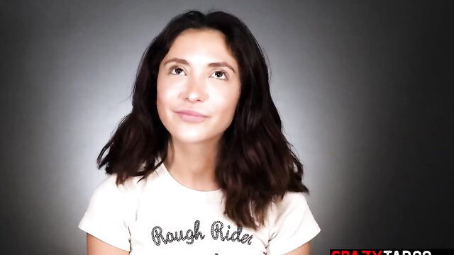 Jane Wilde in tight Rough Rider tee, seductive gaze up close