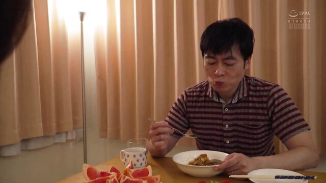Saeko Matsushita eating rice in cozy dinner scene from JAV