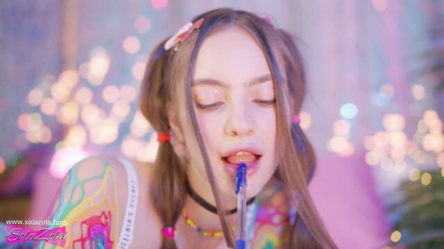 SolaZola sucks pen seductively, pigtails and tattoos tease