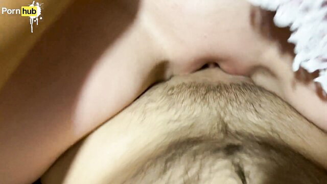 Closeup of stepmom's hairy pussy over stepson's face in hotel bed