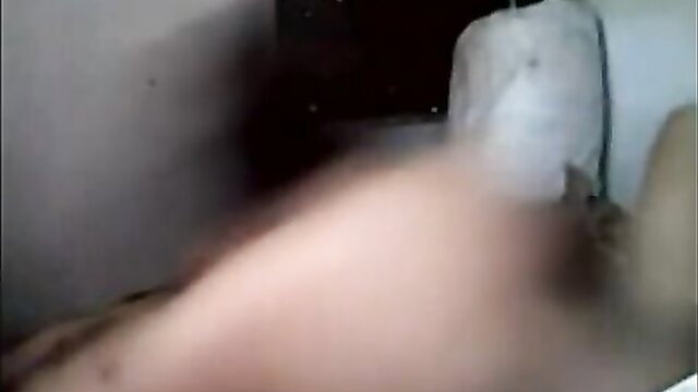 Blurry Indian couple in bed, nude woman with thick thighs on man