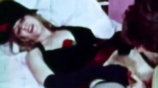 Blonde in black lingerie gets ass fucked by man in hat, classic porn