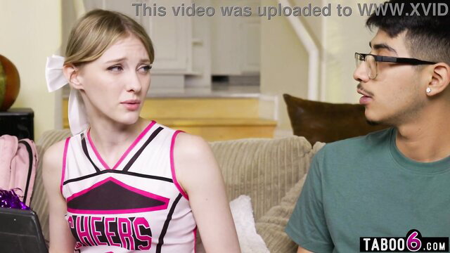 Petite cheerleader Melody Marks with Diego Perez on couch