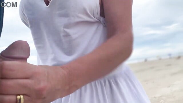 Jane R busty MILF handjobs huge cock on public beach