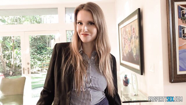 Ashley Lane in sexy blazer and skirt, smiling seductively