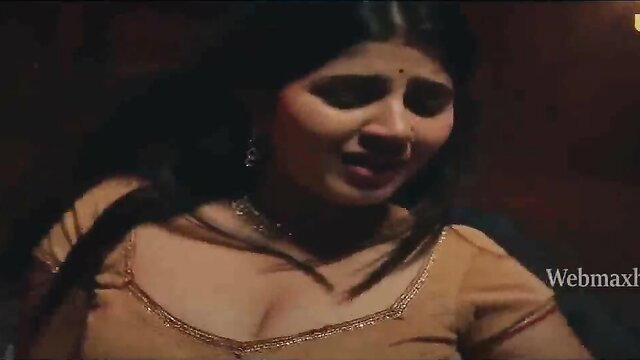 Indian busty beauty in deep cleavage saree blouse closeup