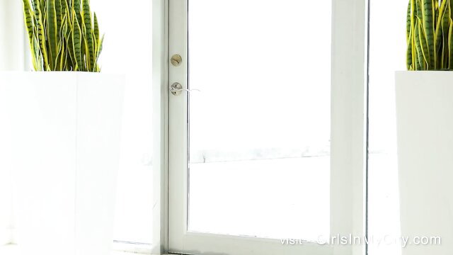 Hot Asian babe in elegant white room with snake plants