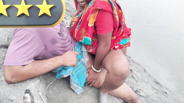 Indian couple outdoor pussy play, sari lifted on riverbank