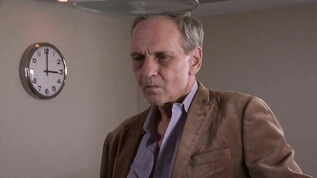 Mature man in suit gazes intently, Sleeping Beauty adult video thumbnail