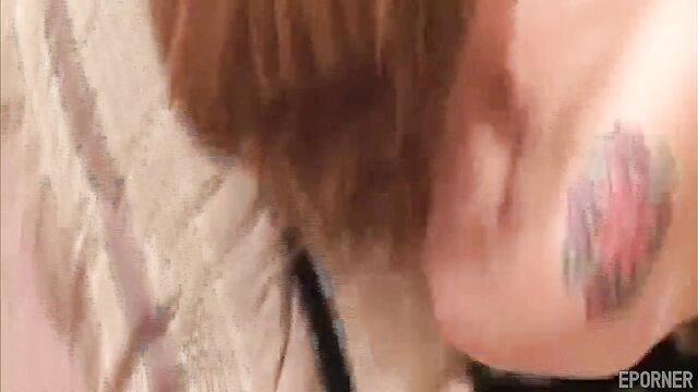 Raunchy vixen with red hair and neck tattoo in steamy closeup