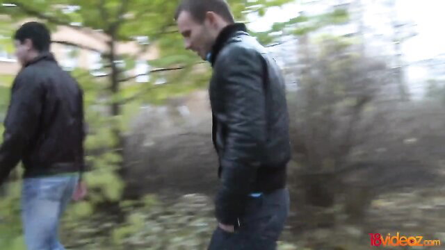 Two men in leather jackets walking in woods, gay amateur thumbnail