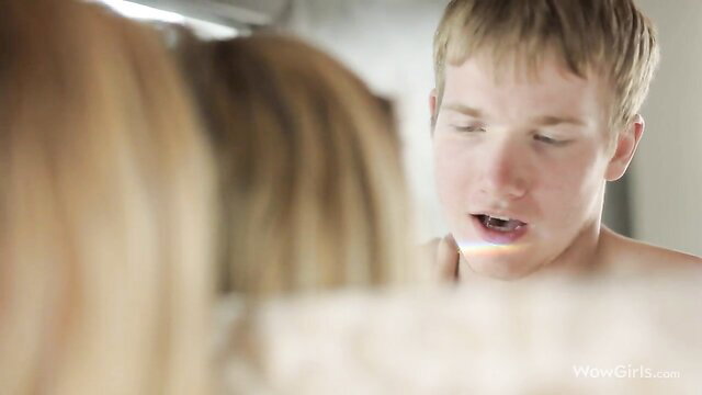 Skinny blonde teen brushes teeth naked as guy embraces from behind in bathroom