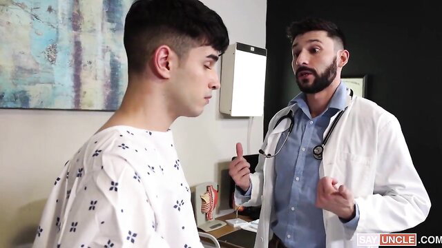 Doctor examines young patient in hospital gown, gay medical play