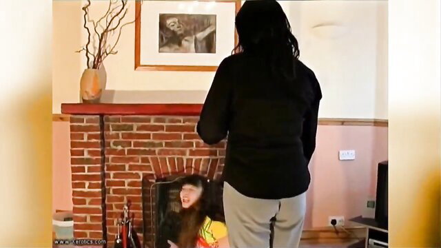 Young brunette schoolgirl caned by domme in lezdom punishment
