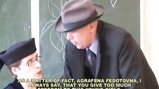 Classroom BDSM caning with suited man and beret girl