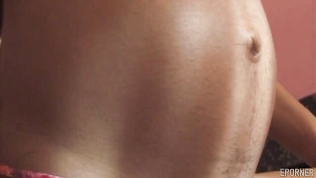 Hot ebony preggo's shiny round belly closeup