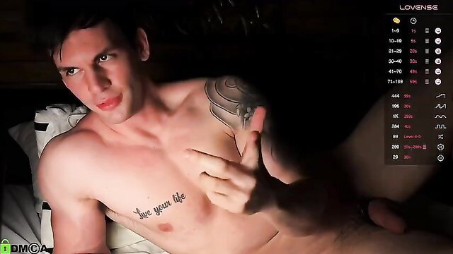 Tattooed muscular guy flashing middle finger while nude on cam