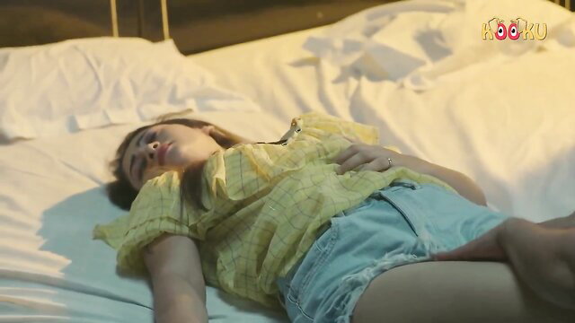 Hot Indian cougar in yellow top and denim shorts on bed, nude tease