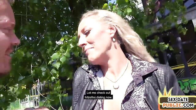 Blonde babe in leather jacket outdoor public date flirt