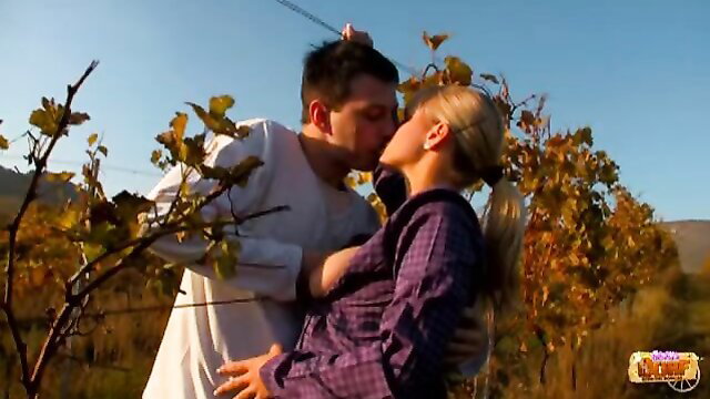 Marry Queen kissing lover passionately in vineyard outdoors