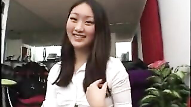 Evelyn Lin smiling in white blouse, sexy Asian babysitter