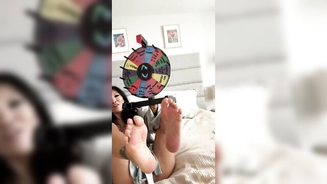 Sayoko Kuroki feet up with toy gun, JAV wheel of fortune tease