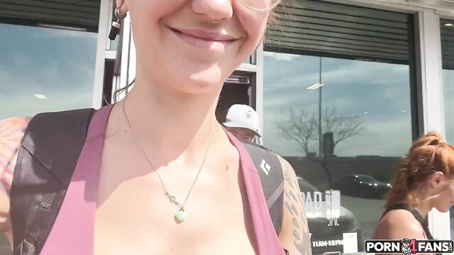 Jessi Rae smiles in tight top, tattoos and necklace, Rocky Emerson nearby