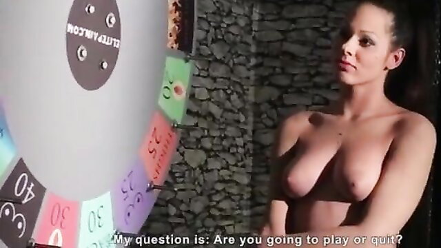 Nude brunette slave at Wheel of Pain, topless tits out, asking play or quit