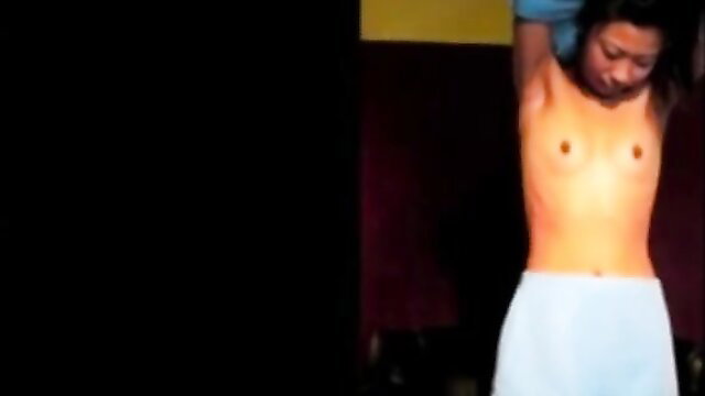 Asian woman bound, topless, crying in brutal BDSM whipping