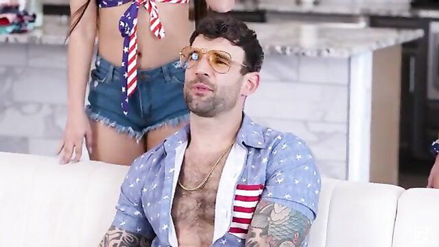 Curvy brunette in American flag bikini seduces fit bearded guy in unbuttoned shirt