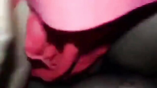 Indian woman with large breasts in pink underwear