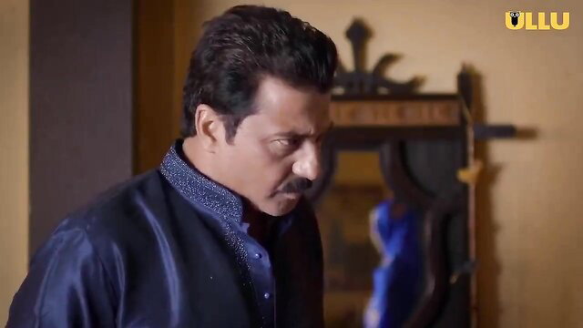 Indian man in blue kurta gazes intently at woman in blue dress in kinky HD scene