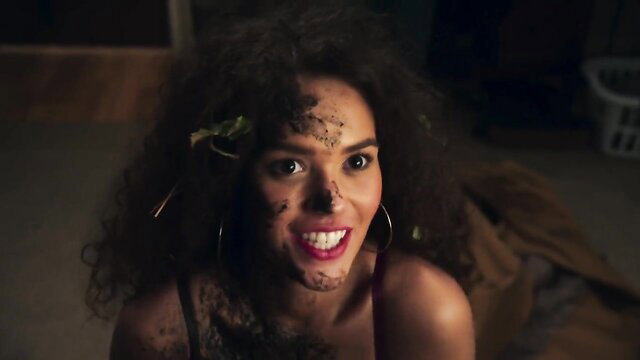Madison Pettis-like curly-haired black babe with mud face smiles topless