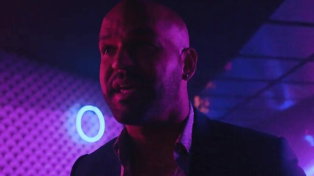 Bald Black man in neon club lighting, Monica Raymund Hightown nude scene