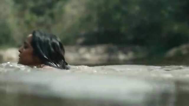 Hot Indian babe with wet black hair in steamy outdoor bath scene