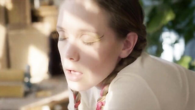 Sensual blonde muse with braided hair in softcore nudity scene