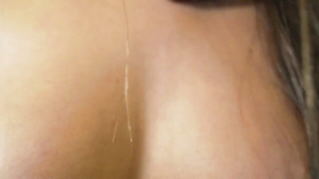 Closeup of hot Latina babe's big boobs and neck with long hair