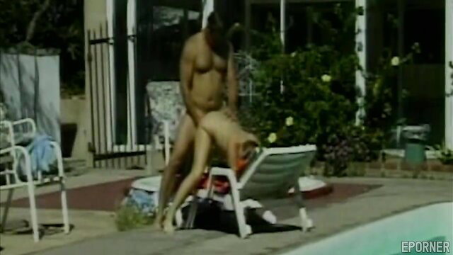 Blonde babe fucked hard outdoors by ripped stud on pool lounger